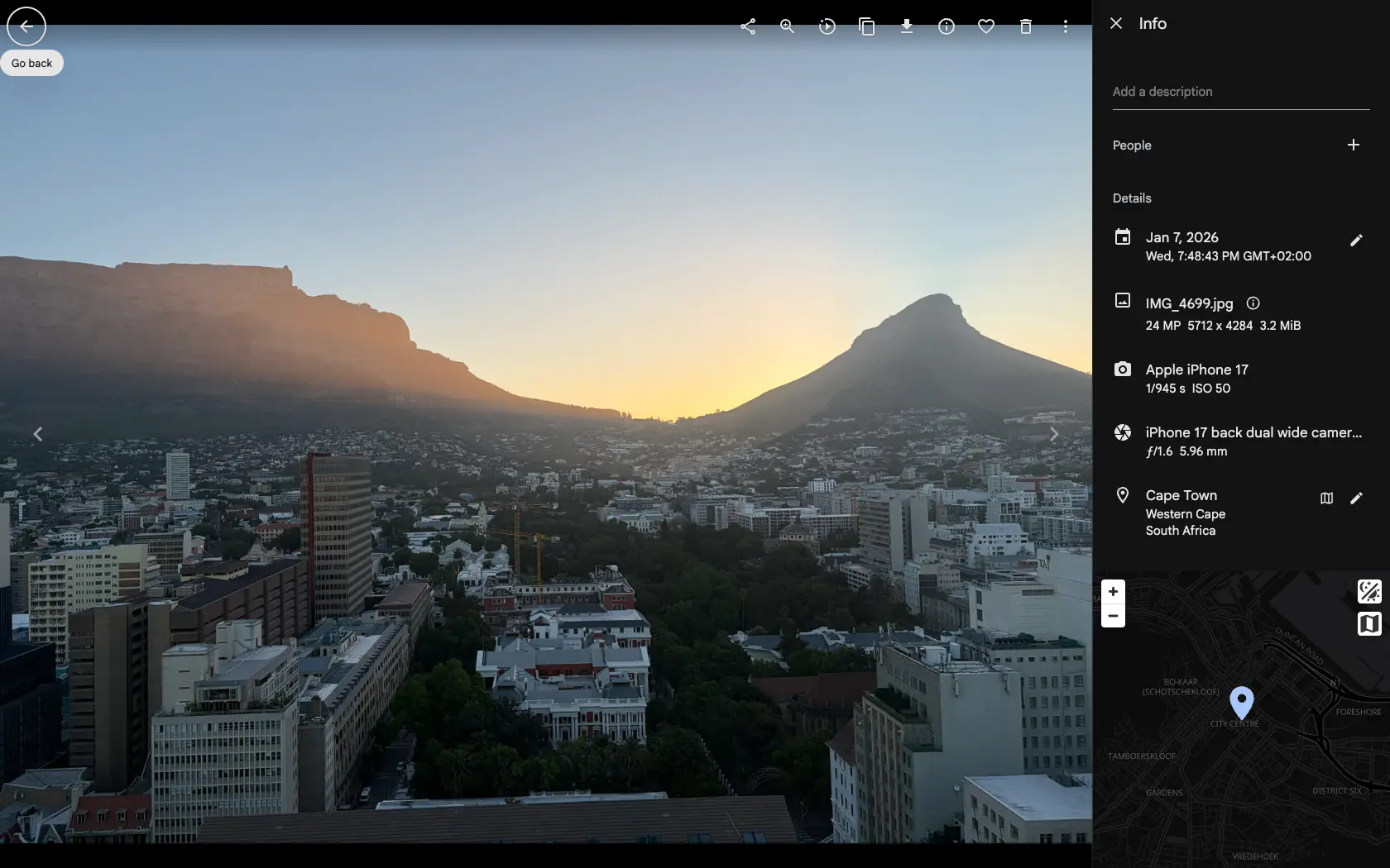 The Gallery asset viewer with the info panel open, showing a photo taken in Cape Town with its date, filename, camera, lens and location — each one clickable as a filter